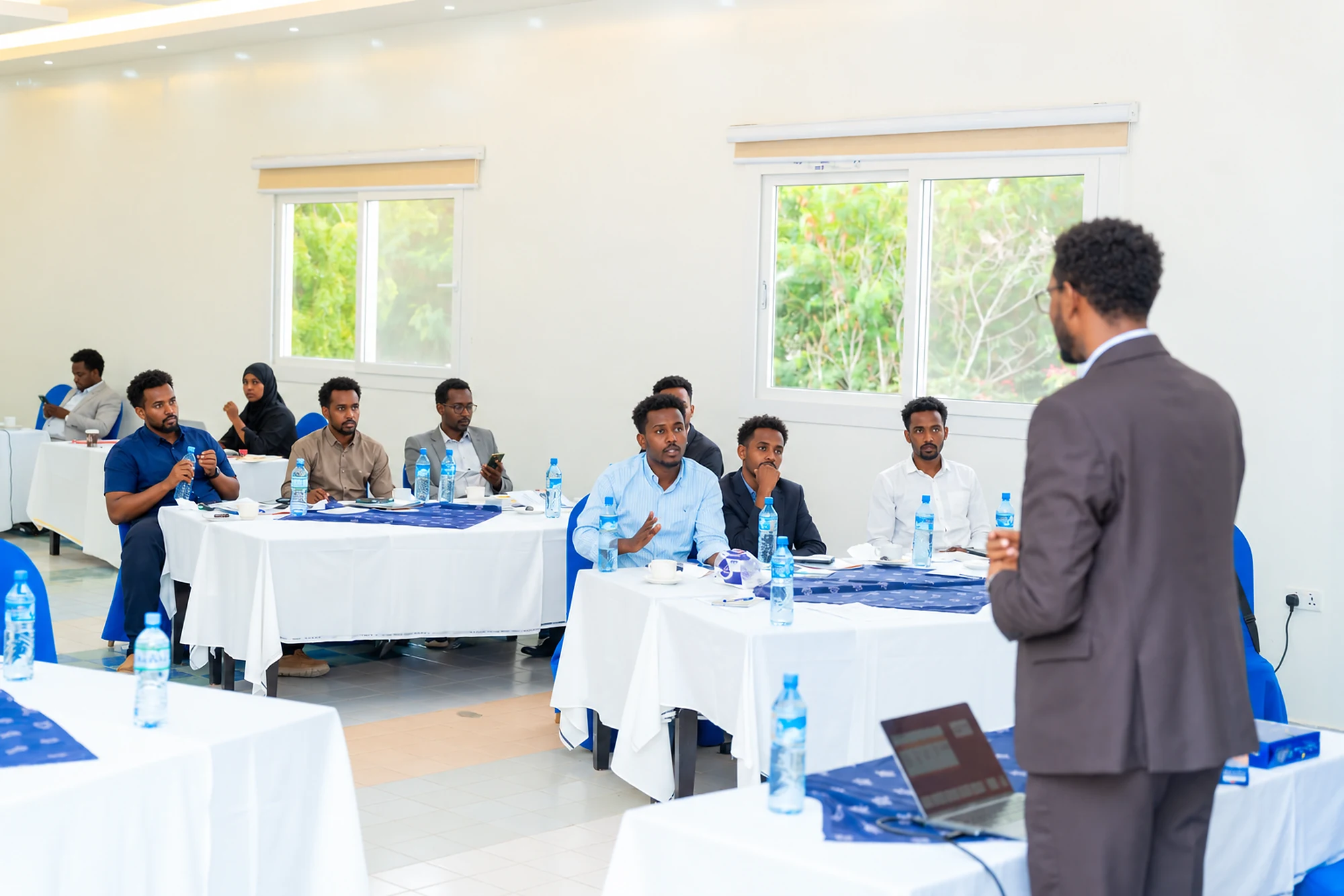 A facilitator presenting institutional policies and procedures
